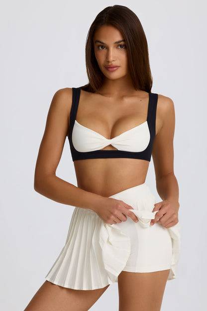 Soft Active Crossover Pleated Mini Skort in Ivory