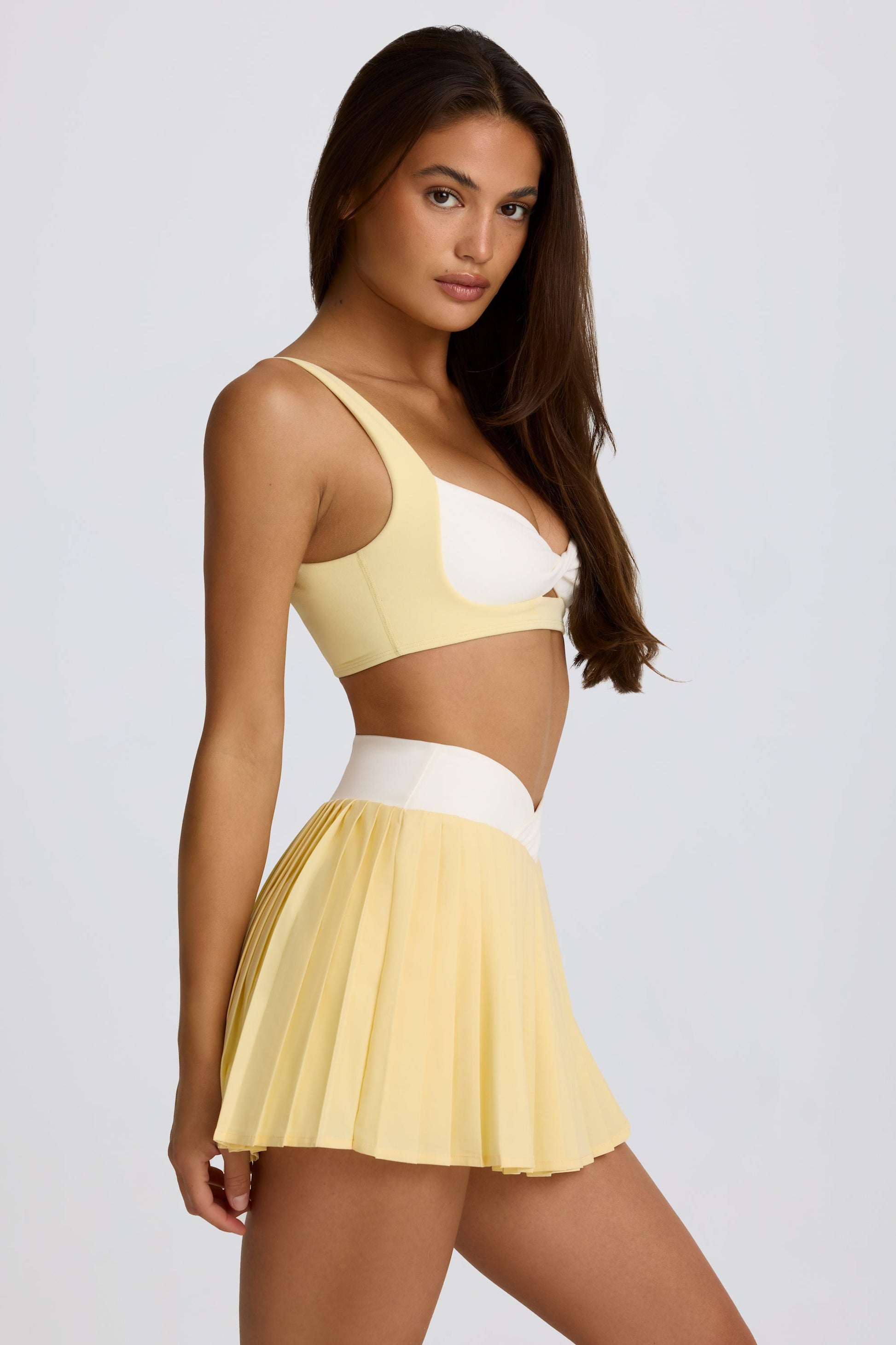 Soft Active Crossover Pleated Mini Skort in Lemon