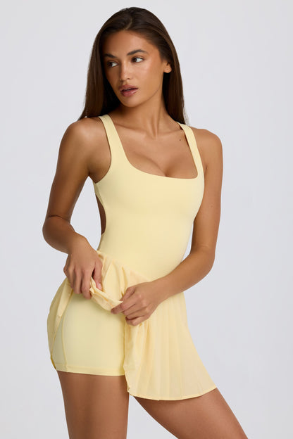 Soft Active Open-Back Pleated Tennis Dress in Lemon